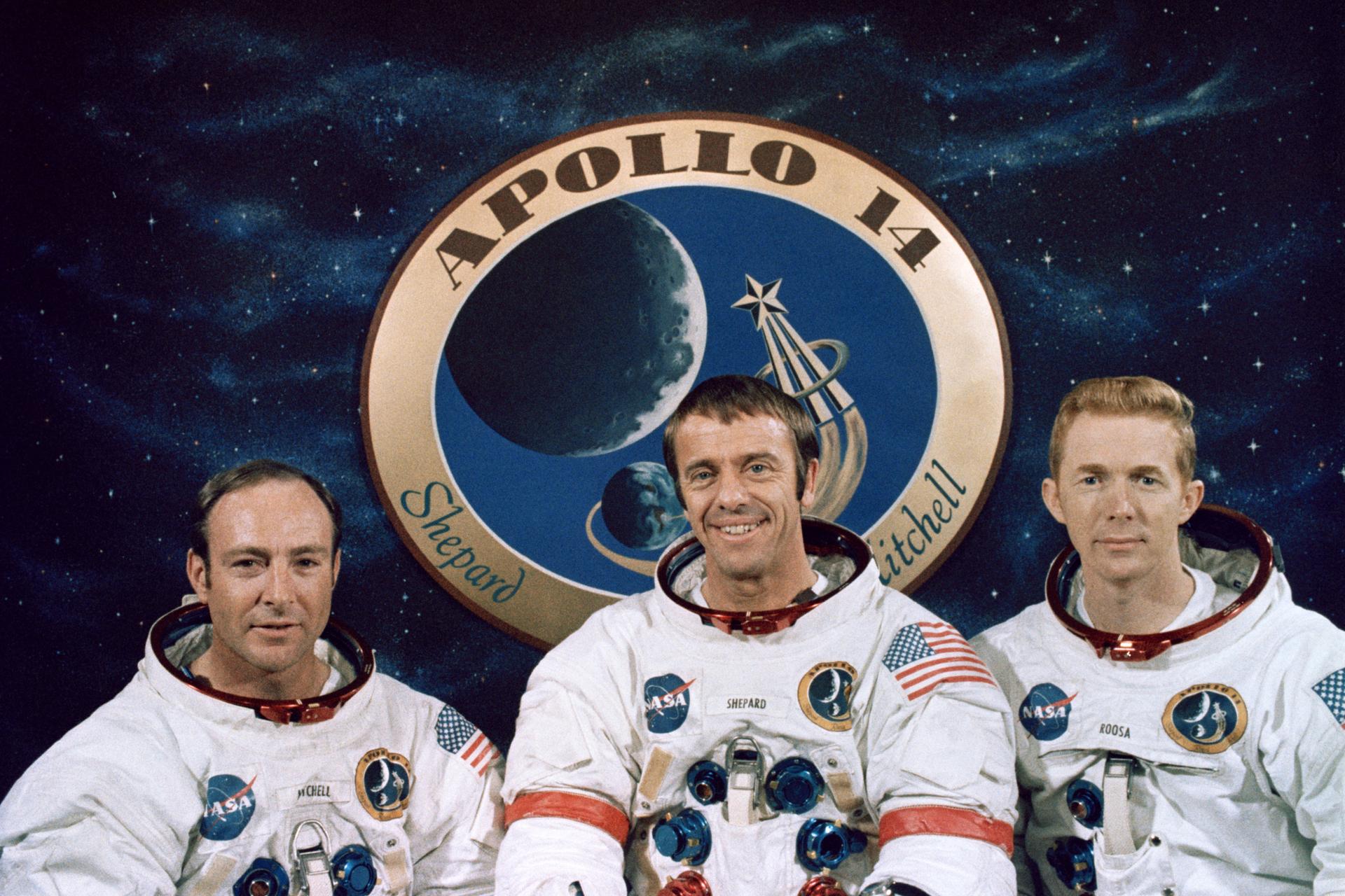 Apollo 14 crew picture with astronauts in white space suits.