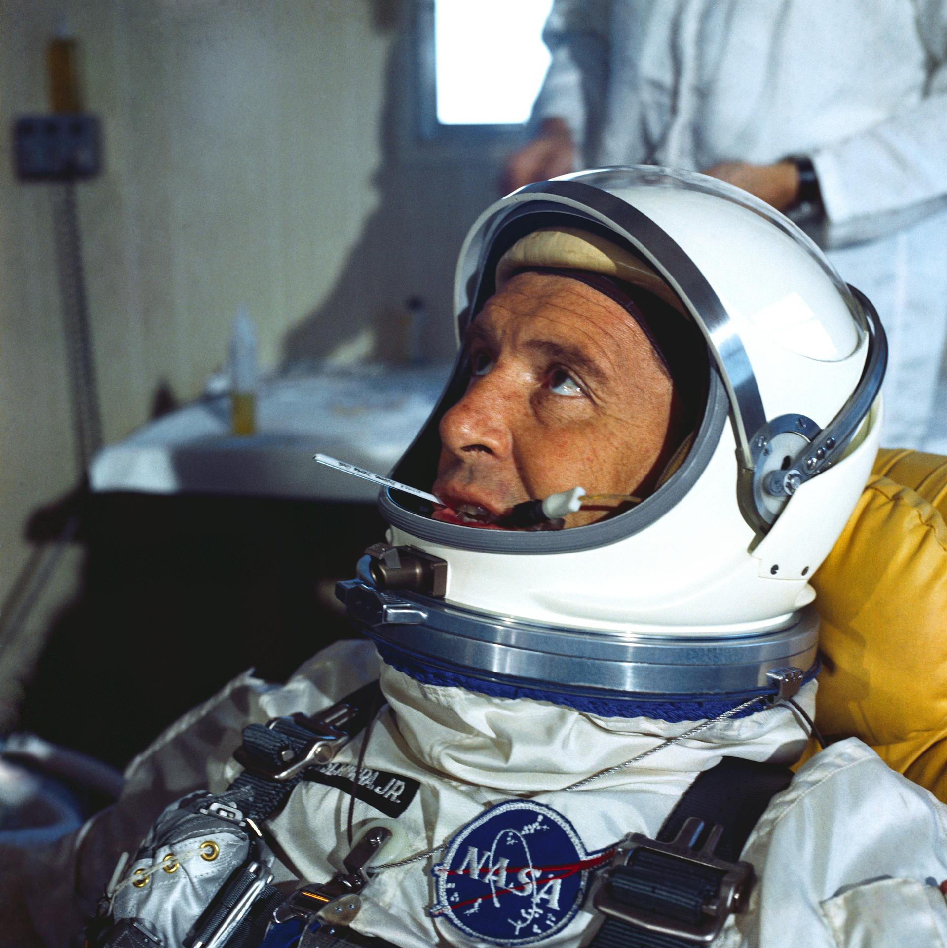 S65-22666 (8 March 1965) --- Astronaut Walter M. Schirra Jr., the command pilot of the GT-3 backup crew, is shown suited up for prelaunch tests. He is shown with his helmet visor up and a thermometer in his mouth.