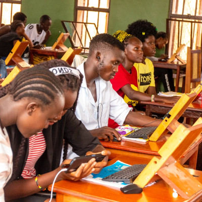 Classroom with students each with a phone and keyboard