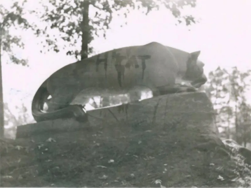 A black and white photo of the back of the Nittany Lion Shrine with “Hepcat” written in black, dripping paint.