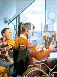 Group of diverse people in office room conversing 