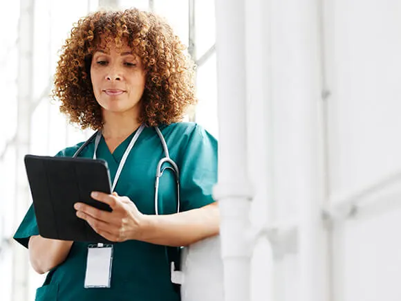 Nurse checking tablet