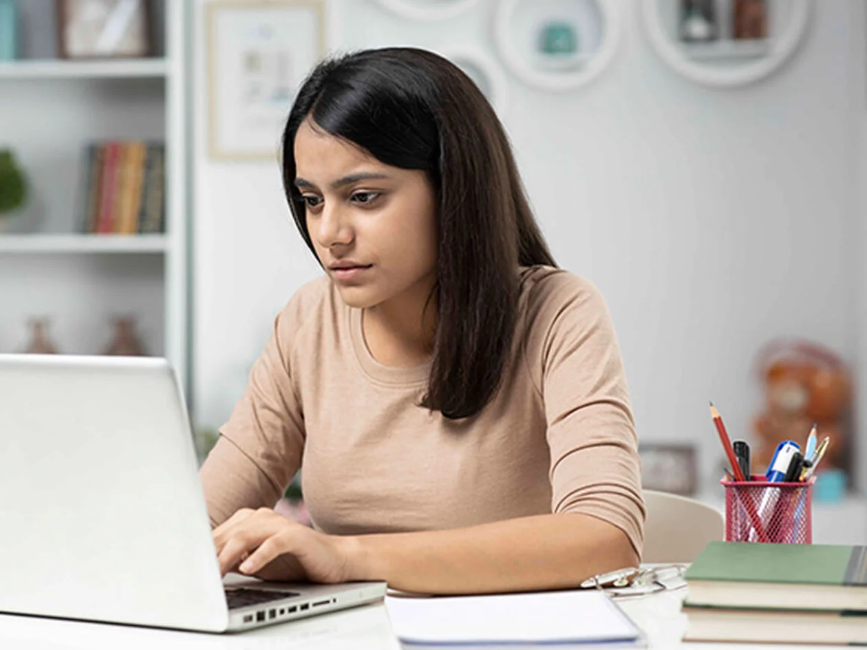 Student working on her laptop