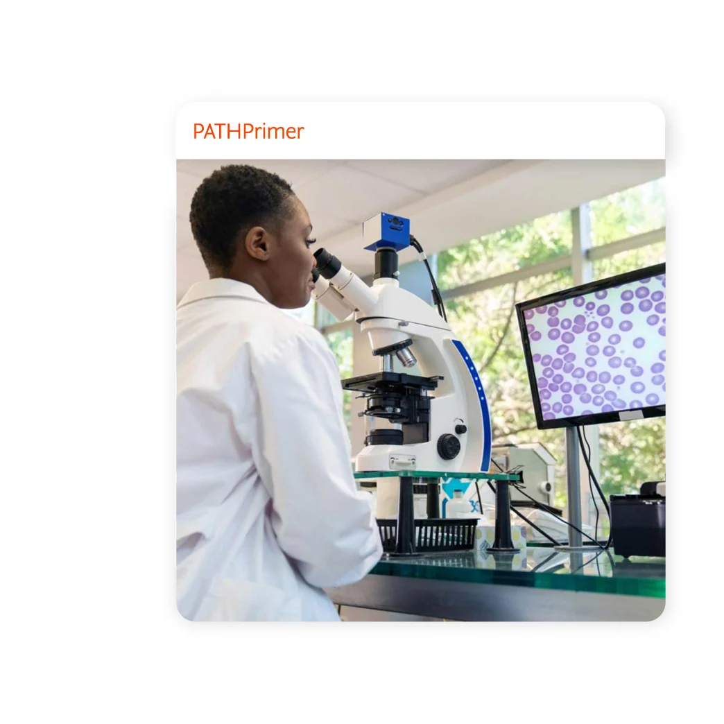 Female scientist looking at cells through a microscope