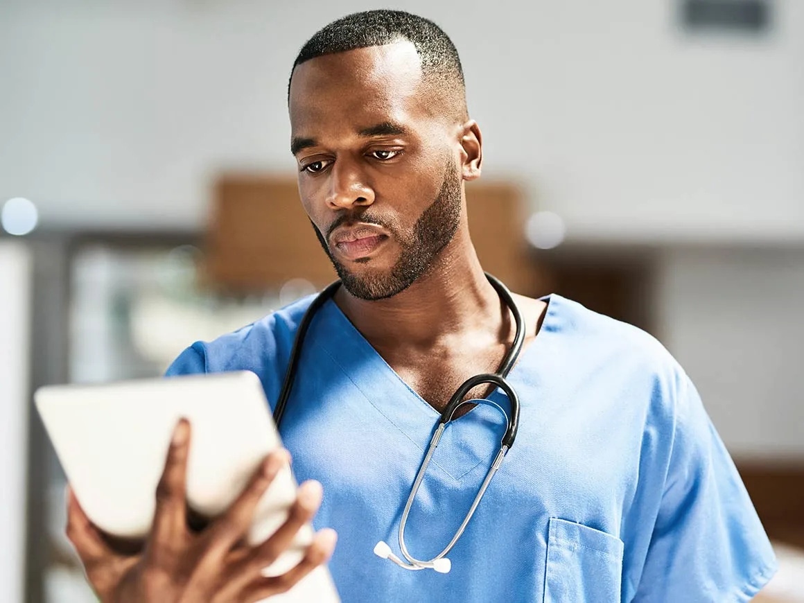 Surgeon putting on mask