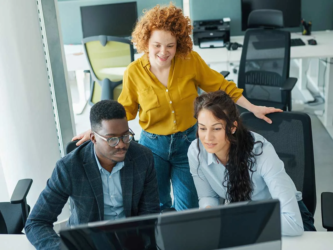 Students sitting around a conference table in a library setting