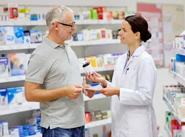 Pharmacist chatting with customer