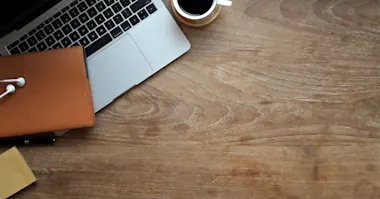 Office items on a wooden desk