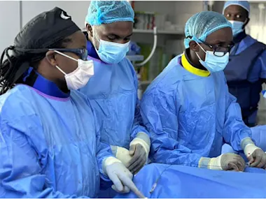 Dr Judy Gichoya (left) supports the interventional radiology medical team in Rwanda, led by Dr Ivan Rukundo. She shared this image with permission in her presentation as one of three panelists on the Lancet Webinar AI and Health Equity in Cancer. 