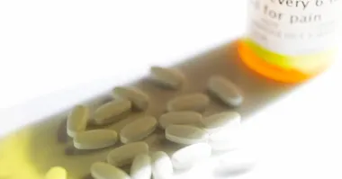 Opoids next to a prescription bottle