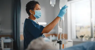 Nurse checking intravenous line