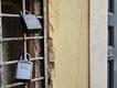 Key boxes protected by a numerical code hang outside an apartment door in Rome's Trastevere district.