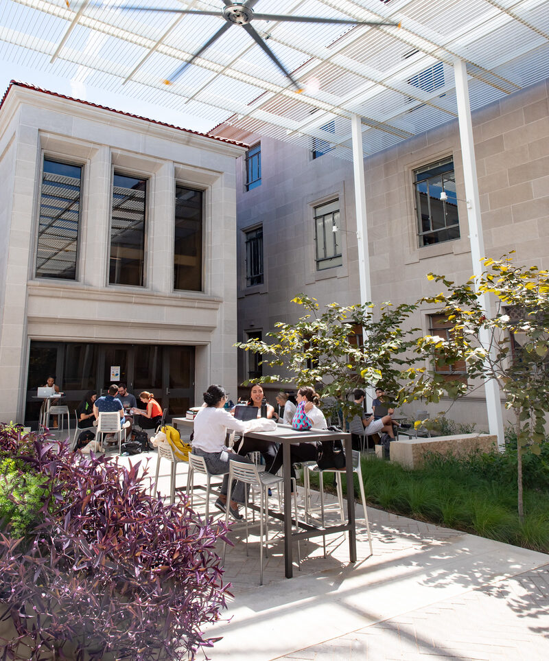 students hanging out in the outdoor plaza