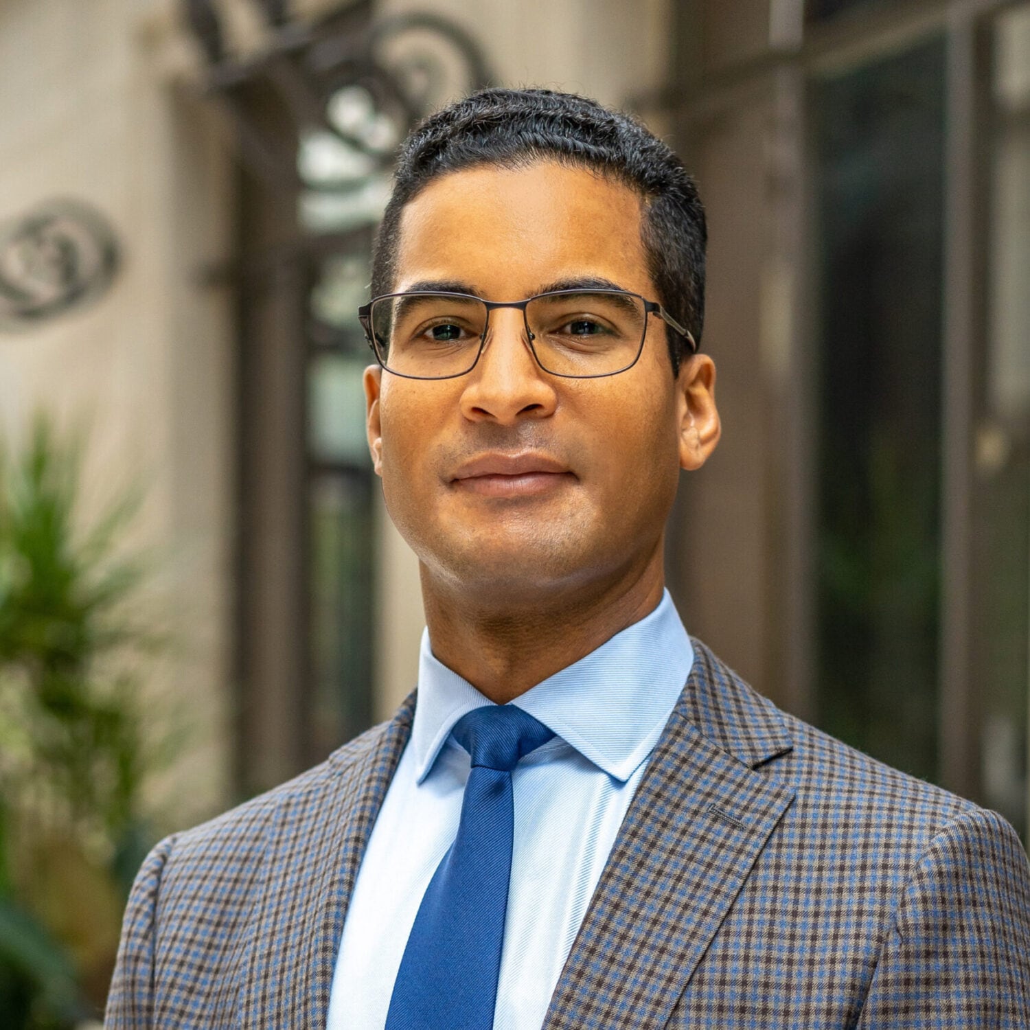 Professor Richard Albert, wearing a gray checked suit and blue tie