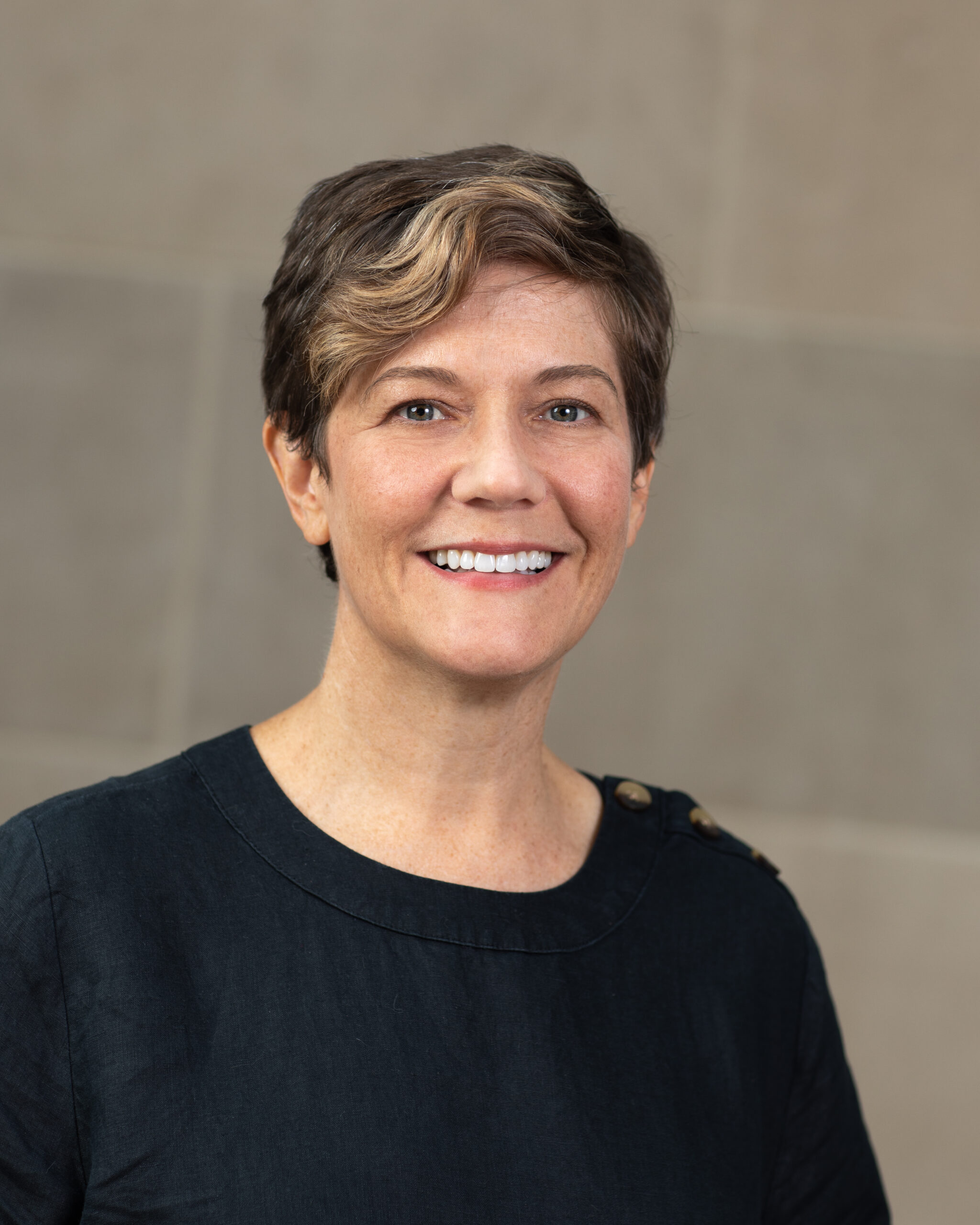 Portrait of Melinda Heidenreich wearing a black blouse.