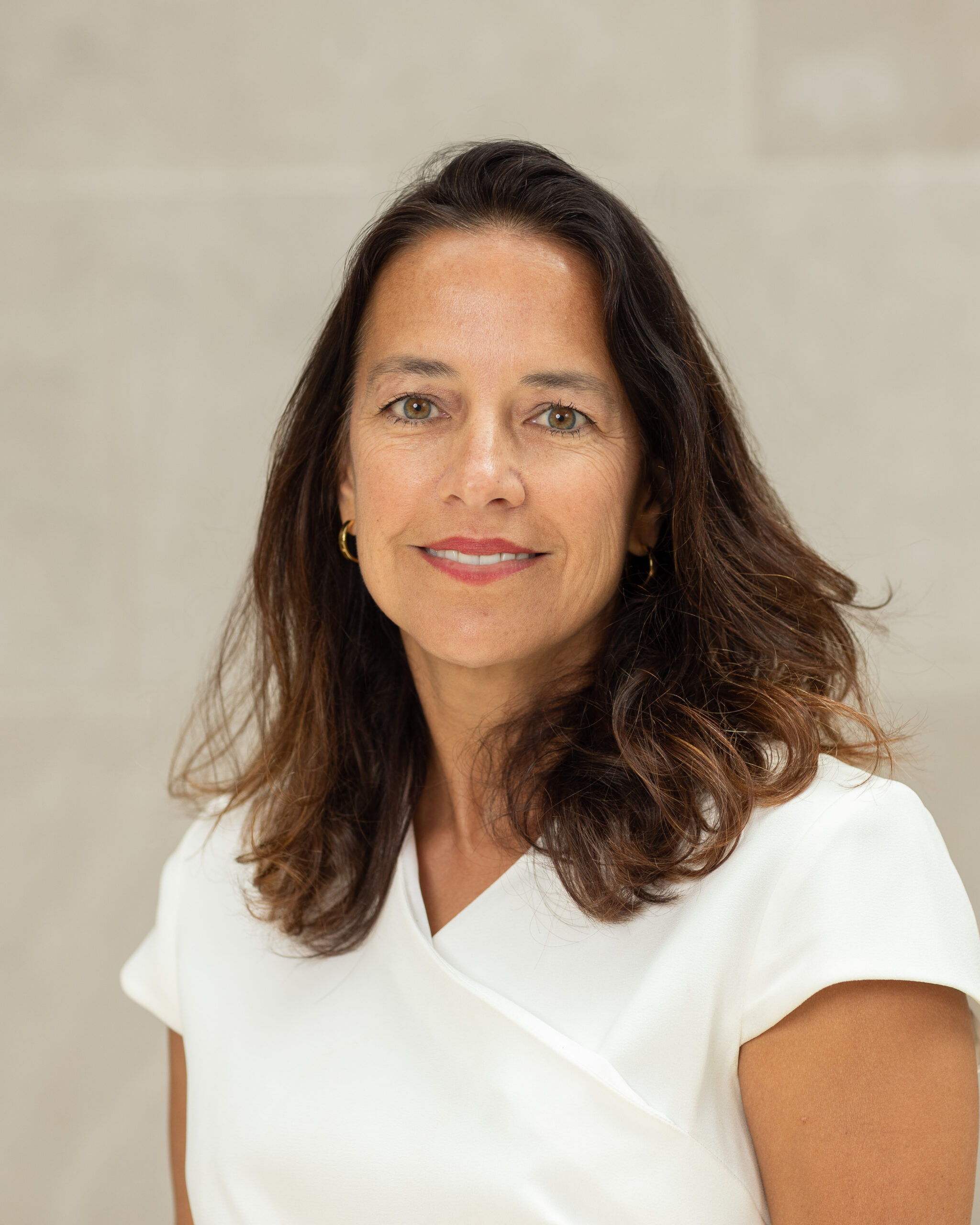 Portrait of Melissa Wasserman wearing a white blouse.