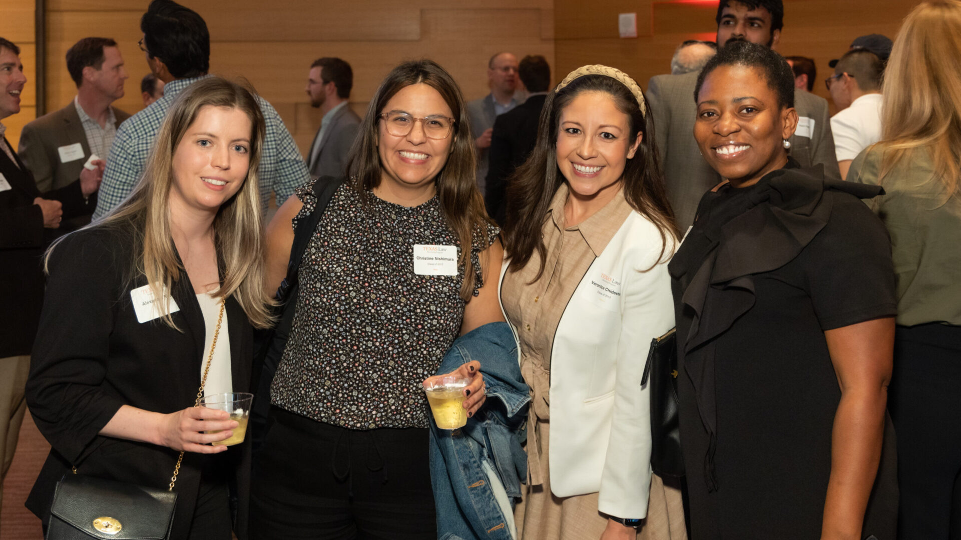 A photo of four alumni at a mentoring event.