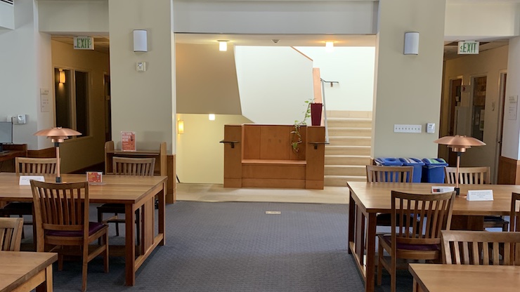 tables and chairs in library study space