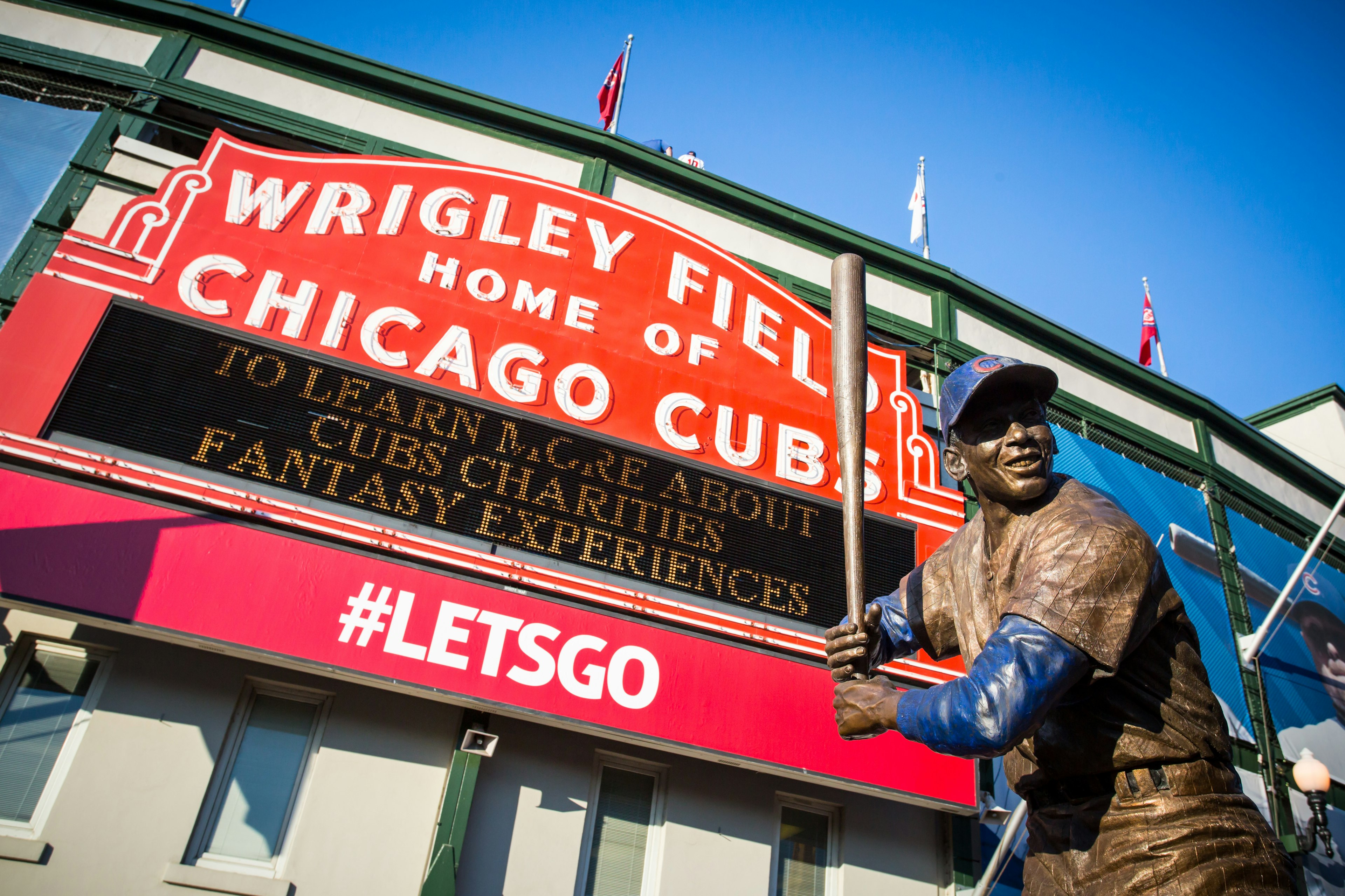 Exterior of Wrigley Field, Chicago, with a statue of baseball star Ernie Banks.