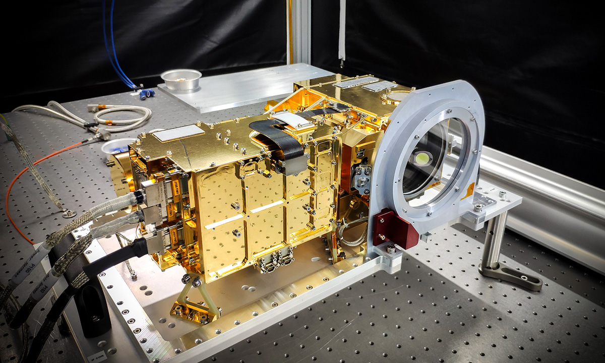 The SuperCam instrument is shown on a laboratory table before being installed on the rover.