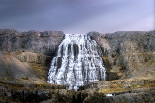 Image may contain River Water Outdoors Nature Waterfall and Cliff