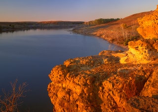 Image may contain Nature Outdoors Promontory Cliff Water and Mountain