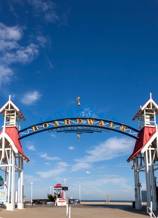 Image may contain Arch Architecture City Nature Outdoors Sky Person and Amusement Park