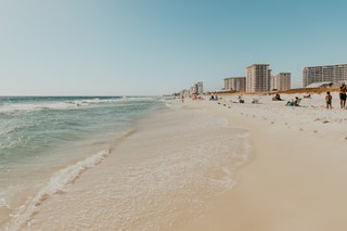 Image may contain Nature Outdoors Sky Horizon Person Beach Coast Sea Shoreline Water City and Urban