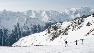 Image may contain Nature Outdoors Person Mountain Mountain Range Peak Snow Leisure Activities Skiing and Sport