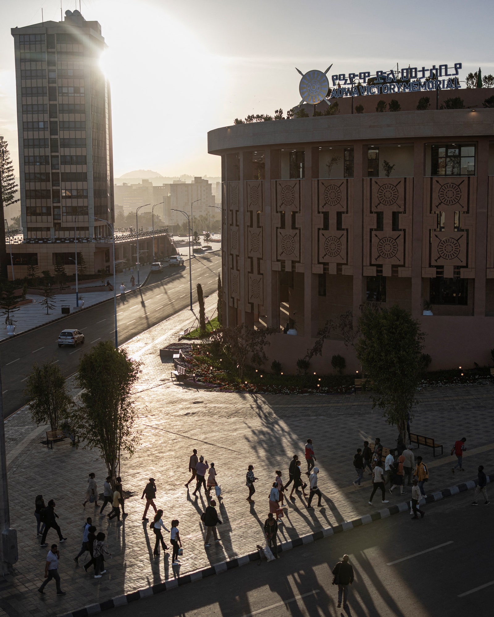 Image may contain City Urban Road Street Path Person Walking Car Transportation Vehicle Metropolis and Downtown