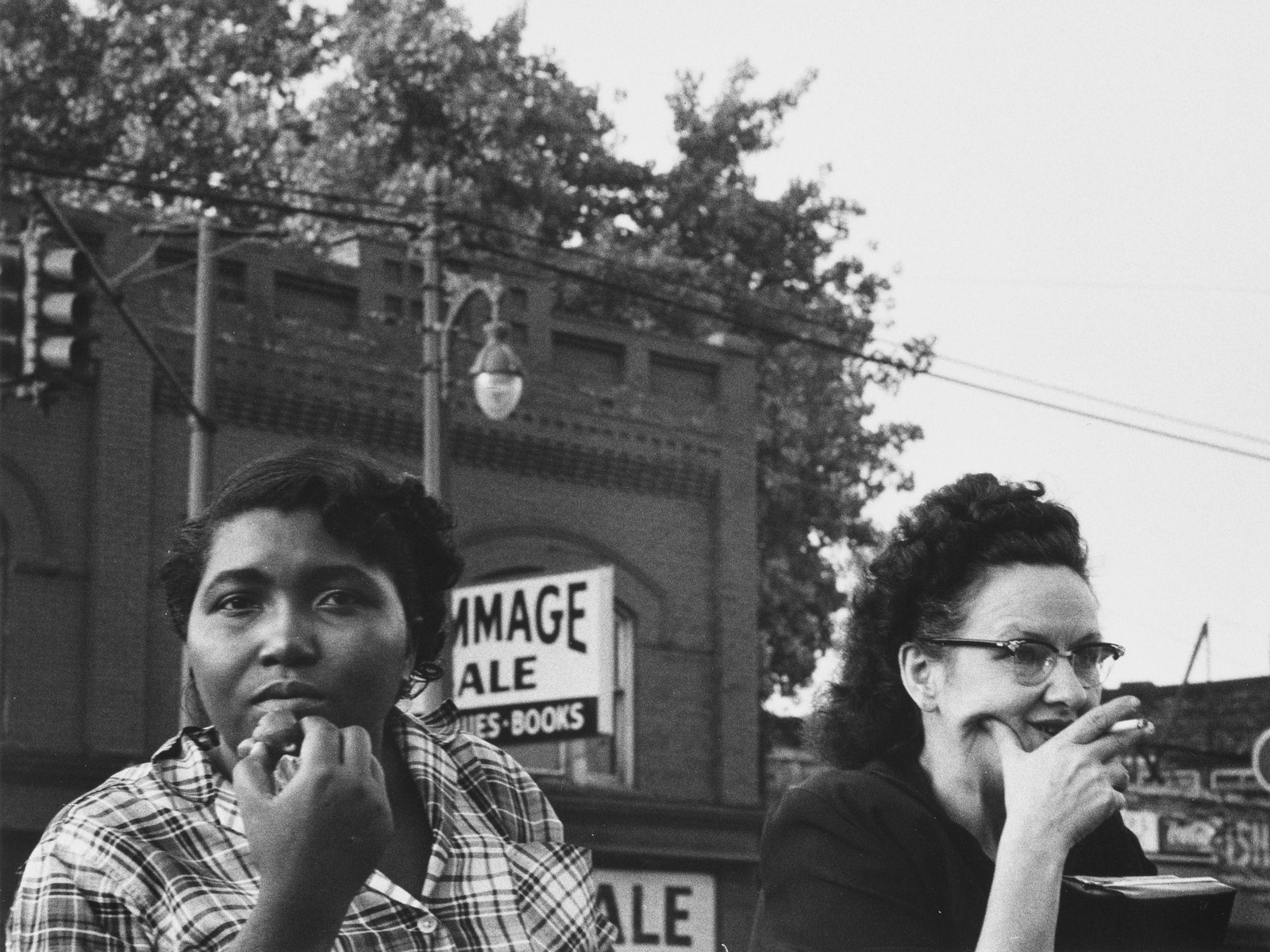 A blackandwhite photo by Robert Frank showing two women outside.