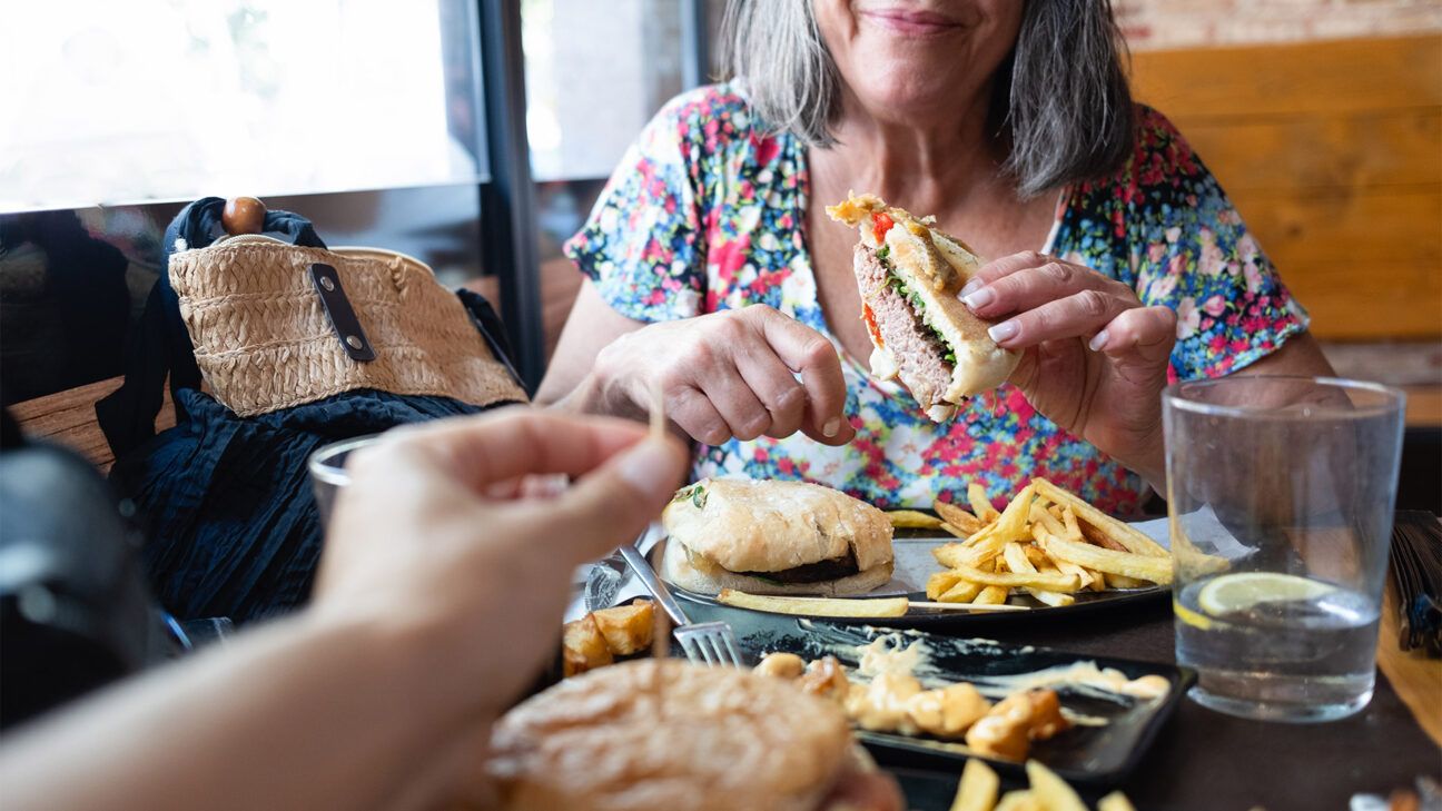 Female eats fast food at a restaurant