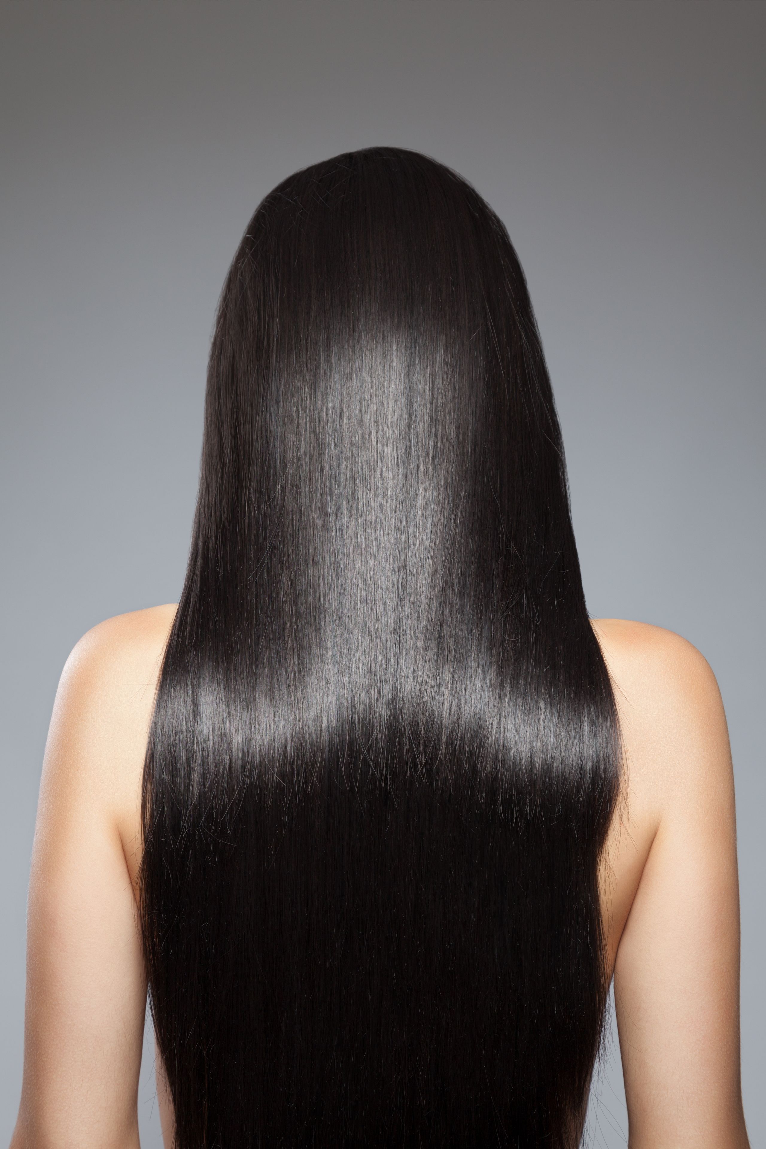 Back view of a woman with long straight hair