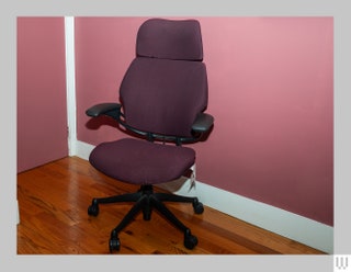 Red office chair in room with red walls