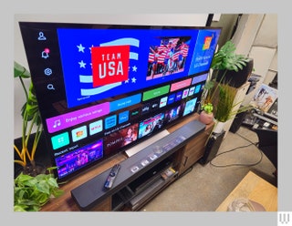 Side view of large screen tv with app thumbnails on the screen