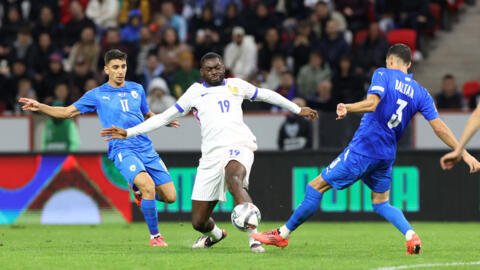 France's Youssouf Fofana in action with Israel's Matan Baltaxa at Bozsik Arena in Budapest, Hungary, on October 10, 2024.