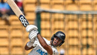 Rachin Ravindra hit 134 as New Zealand scored 402 to lead India by 356 runs in the first cricket  Test in Bengaluru