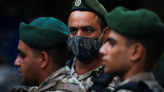 Lebanese army members work on the day after an Israeli strike in Beirut, Lebanon, on September 21, 2024.