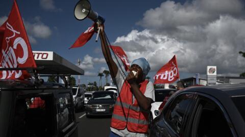 Members of the union CGT Martinique union (General Confederation of Labour) protest in Fort-de-France, in the French Caribbean island of Martinique, on October 15, 2024, amid riots over rising prices.