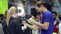 'Trying to have fun': Rafael Nadal signs tennis balls after he was defeated by Carlos Alcaraz