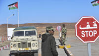 File photo: A flag of the Western Sahara, known as the Sahrawi Arab Democratic Republic, flutters at a checkpoint manned by members of the Sahrawi security forces outside the refugee camp of Dakhla, a