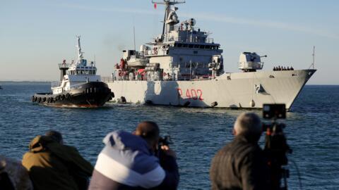 A navy boat carrying migrants intercepted in Italian waters arrives at Shengjin port in Albania on October 16, 2024.