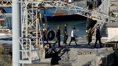 Migrants intercepted in Italian waters disembark at Shengjin port in Albania -- the first arrivals under a new deal between Rome and Tirana