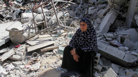 A woman sits on the rubble of a destroyed building, after Israeli forces withdrew from a part of Jabalia refugee camp, following a raid, in the northern Gaza Strip, May 30, 2024.