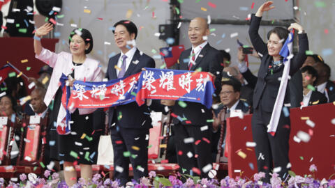 From left, Taiwan first lady Wu Mei-ru, Taiwanese President Lai Ching-te, Speaker of the Legislature Han Guo-yu and Vice President Hsiao Bi-khim cheer during National Day celebrations in front of the