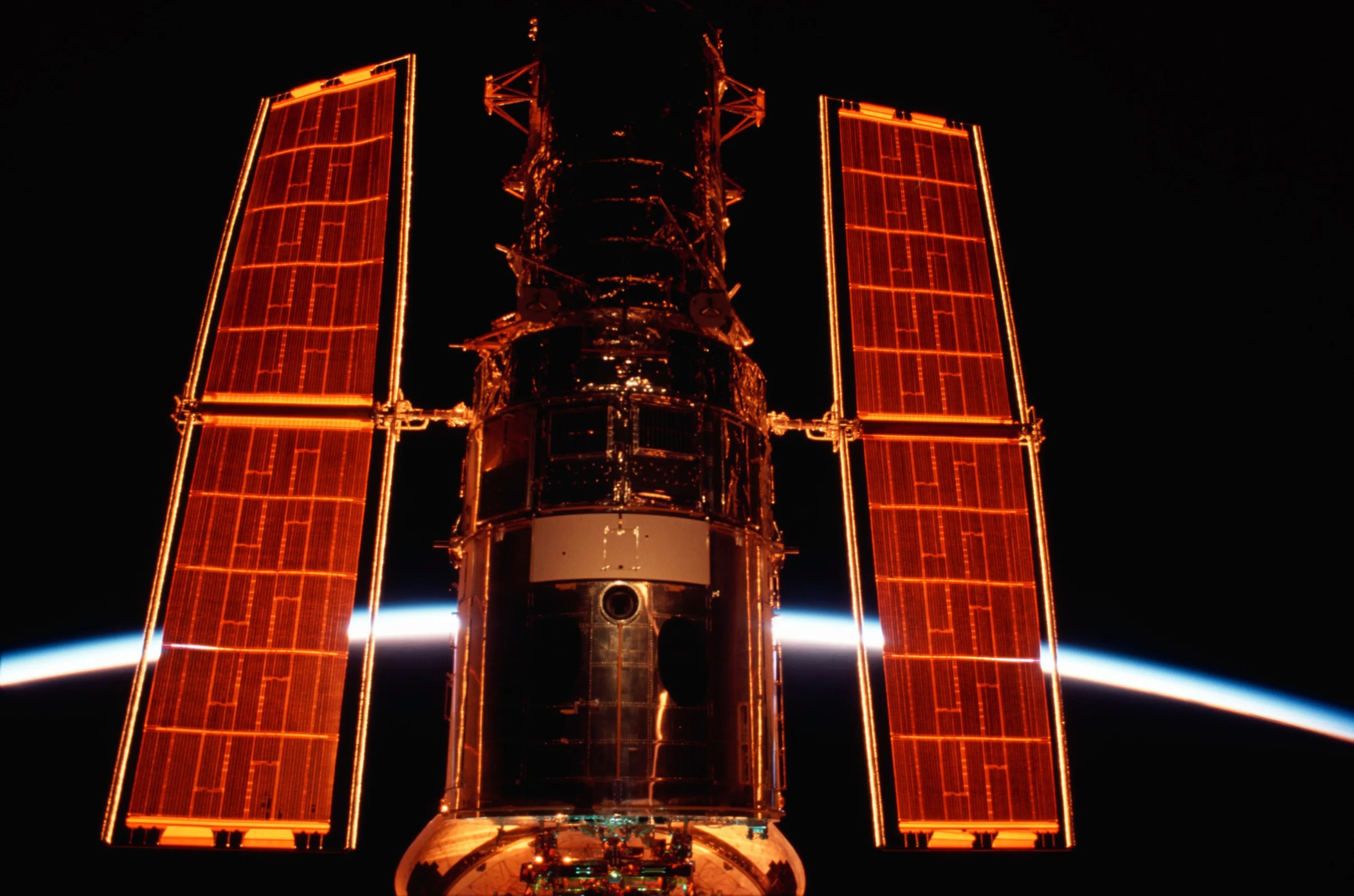 The hubble space telescope (hst) berthed in the cargo bay of the space shuttle columbia during the sts-109 mission.