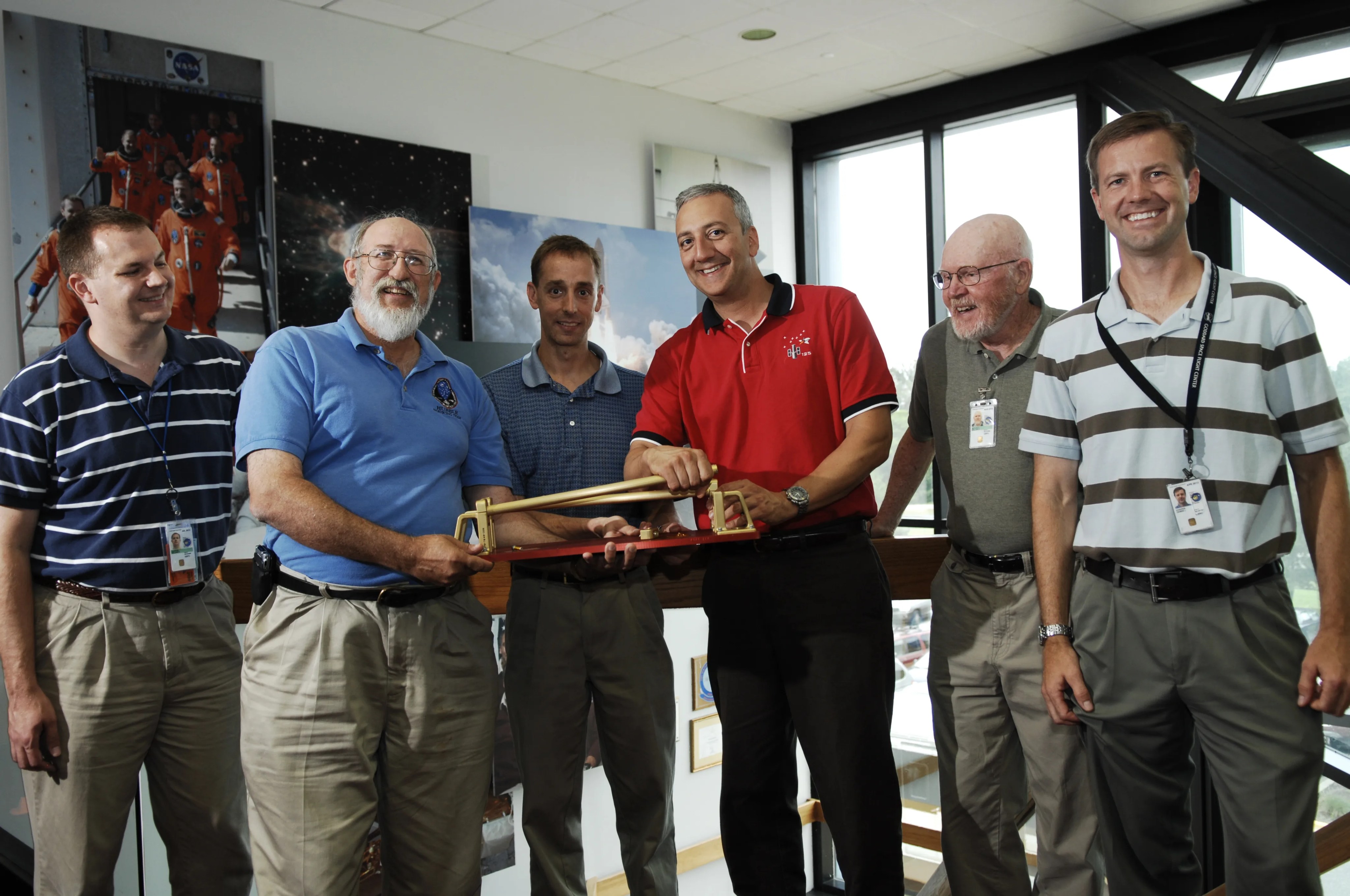 Hubble Team poses with handrail mockup