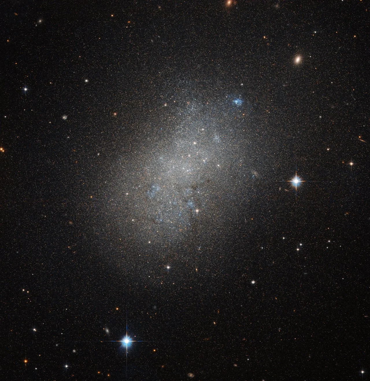 Glow of stars in a hive-like structure.