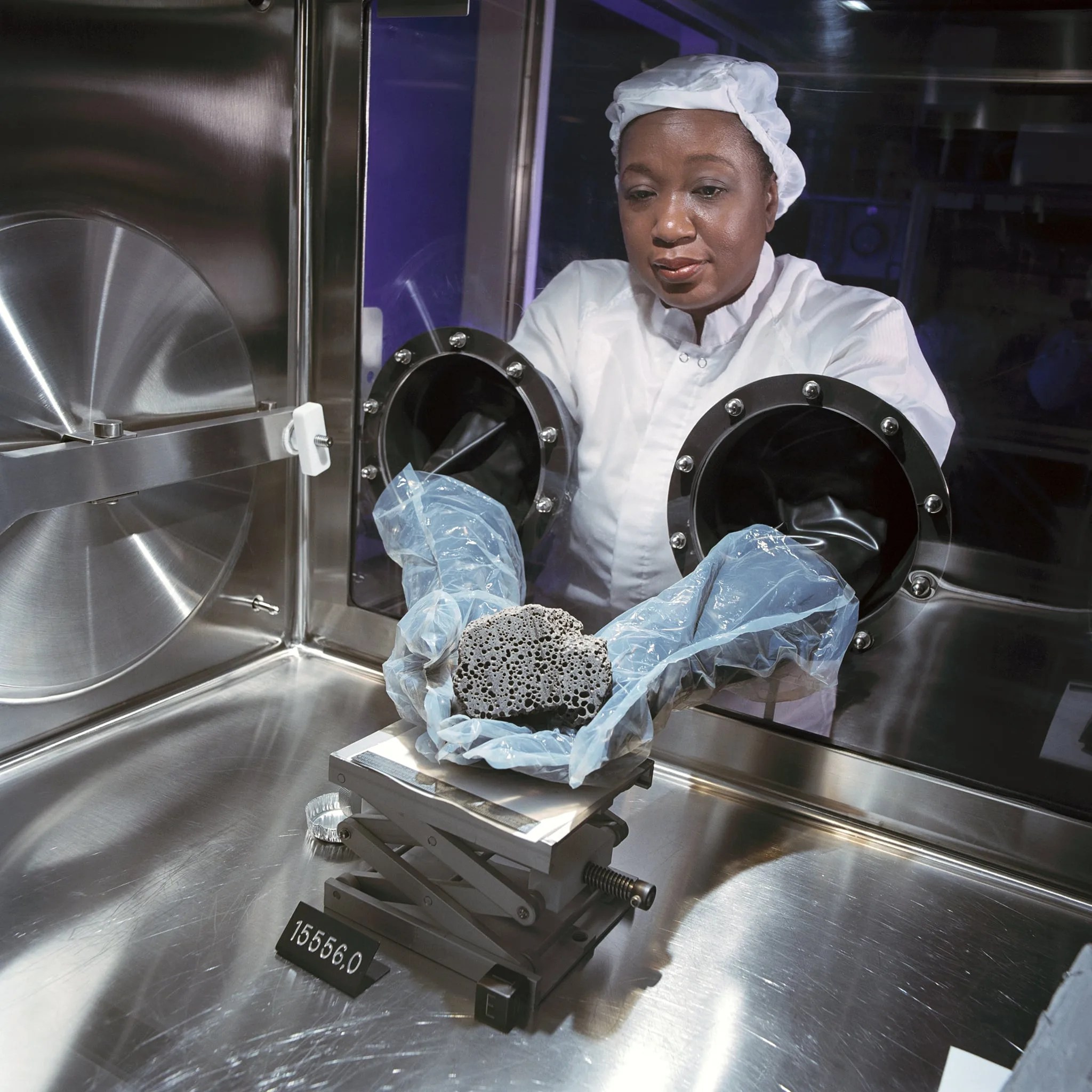 Scientist holds a lunar sample returned by the crew of Apollo 15