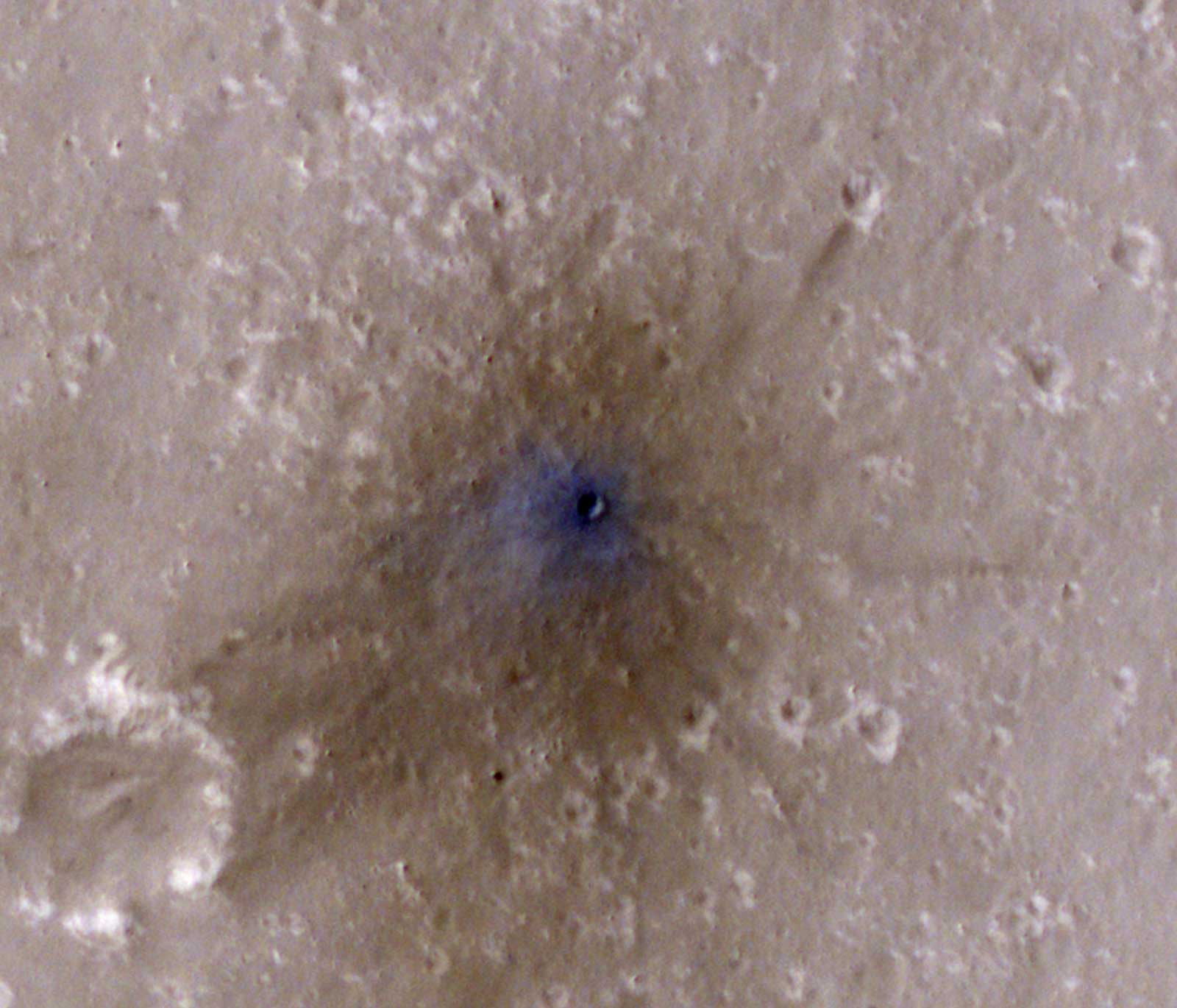 Fresh dirt has been blasted away from the center of these meteor crater impact site.